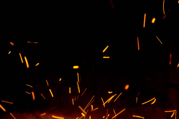 istock Fire sparks in the air near the fireplace 1049241536