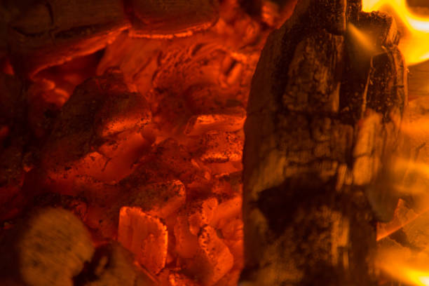 istock Close-up glowing charcoal hot pieces background texture 1049241668