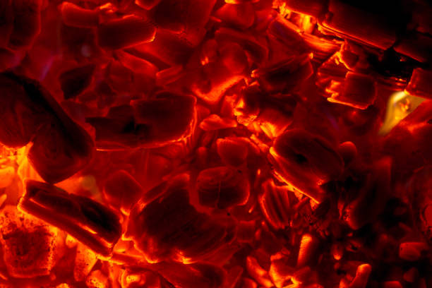 Glowing charcoal close-up pieces background texture