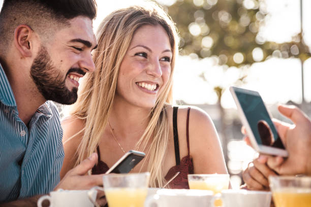 istock friends at the cafe using social media 1049244500