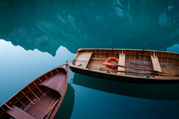 istock Wooden boat on the mountains lake. 1049254644