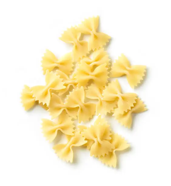 fresh pasta Farfalle isolated on white background, top view