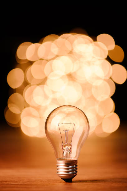 istock close up view of light bulb and bokeh lights on background 1049255404