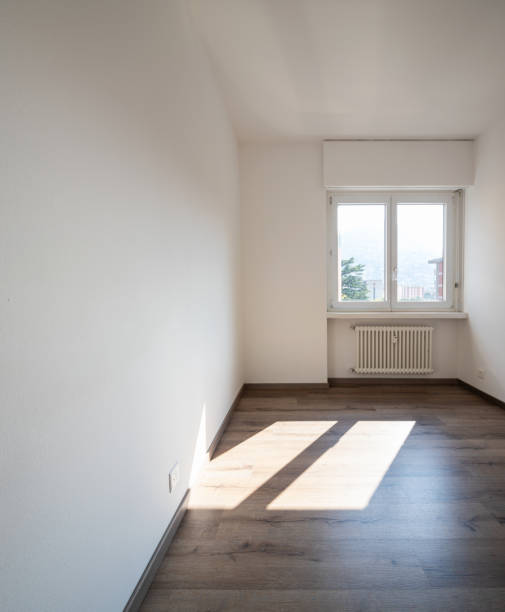 istock Empty room with parquet and window with a view 1049262382