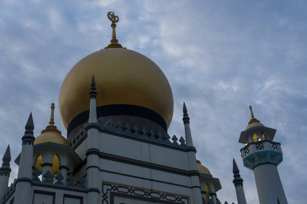 istock Closeup of Masjid Sultan with dramatic clouds during sunset 1049263358