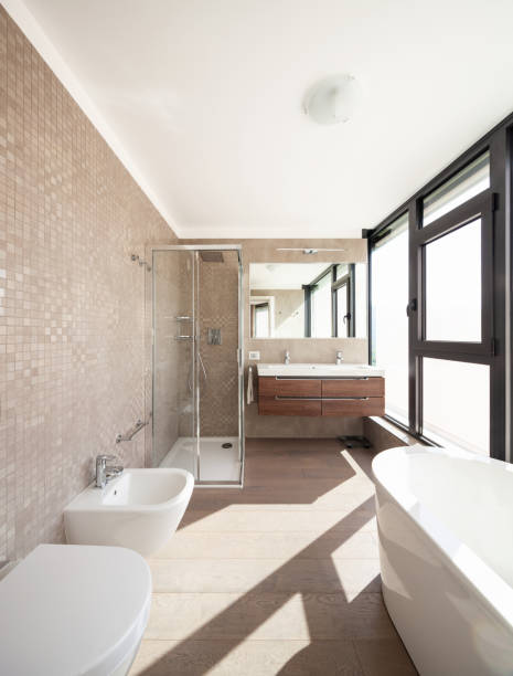 istock Modern wooden bathroom with large windows 1049265940
