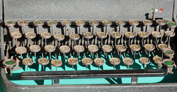 Old black type writer in a junk shop