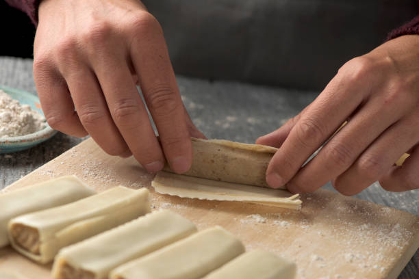 istock man preparing meat stuffed cannelloni 1049269860