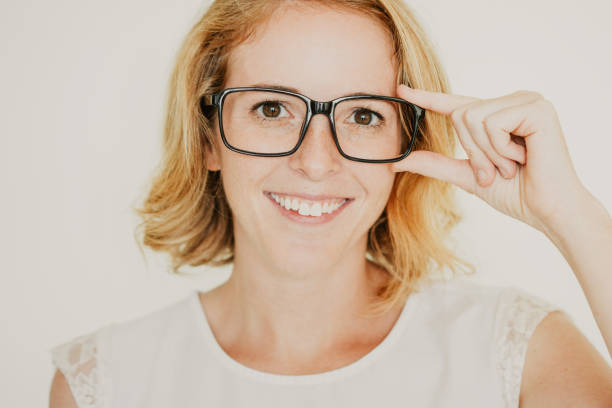 istock Happy woman looking at camera and smiling 1049270338