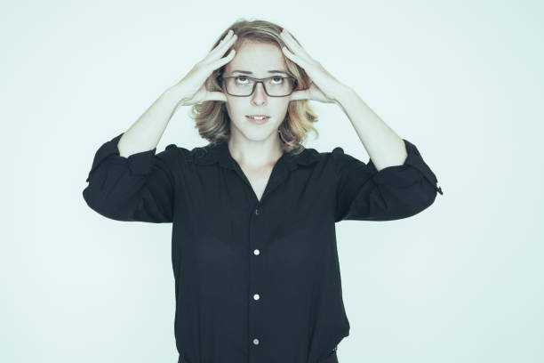 istock Pensive pretty lady trying to concentrate 1049270380