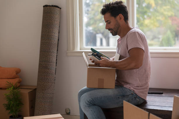 istock A man moving into a new home 1049273802