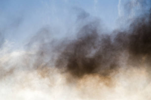 Black smoke from a ship starting its main engines and preparing to leave