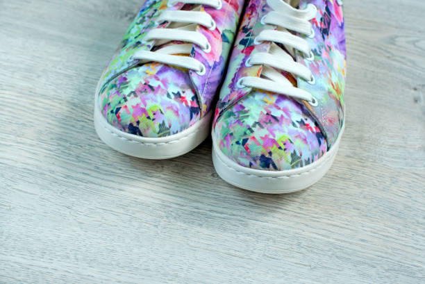 istock Women's shoes on wooden background 1049277190