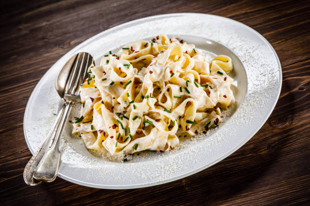 istock Pasta with cream sauce and vegetables 1049277242