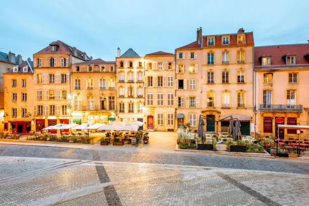 Street view on the beautiful old residential buildings in the center of Metz old town during the twilight in France