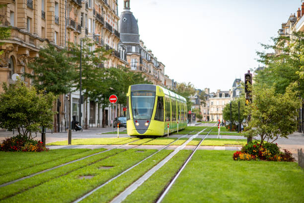 Street view in Reims city, France Street view with green railway of public transport in Reims city in Champagne-Ardenne region of France tram stock pictures, royalty-free photos & images