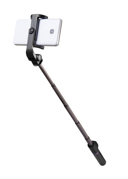 Selfie stick monopod and cellphone isolated on white with clipping path stock photo