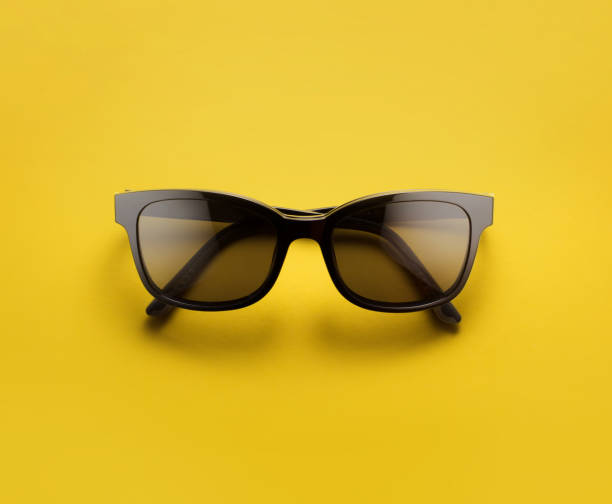 istock Glasses isolated on yellow with clipping path 1049281458