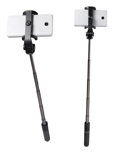 istock Selfie stick monopod and cellphone isolated on white with clipping path 1049281504