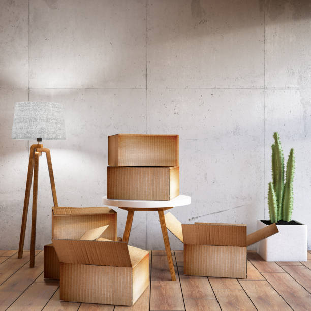 istock Moving into a new house Concept with Cardboard Boxes 1049282074