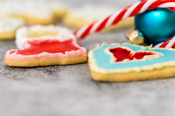 istock Christmas cookies, bauble and candy cane on grey background, copyspace 1049284802