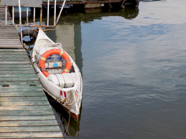 istock Canoe mooring by the jetty in the river, ready for training 1049285294