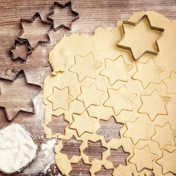 Flatlay, cookie dough with cookie cutters and flour, homemade christmas bakery