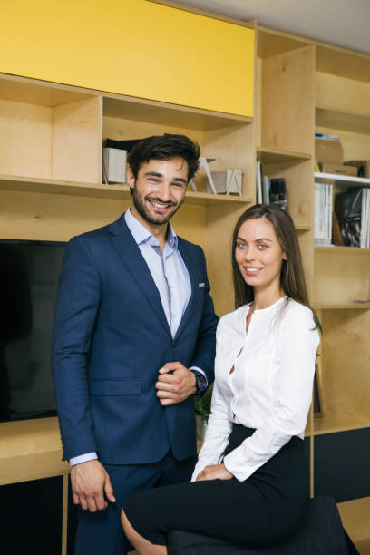 istock Young young people standing in office 1049286264