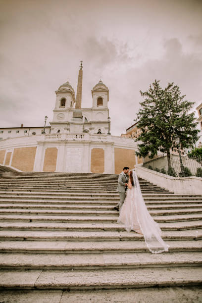 istock Young wedding couple on Spanish stairs in Rome 1049288660