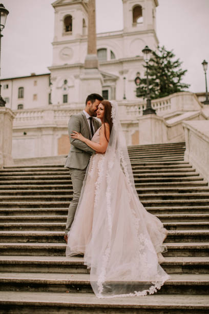 istock Young wedding couple on Spanish stairs in Rome 1049288662