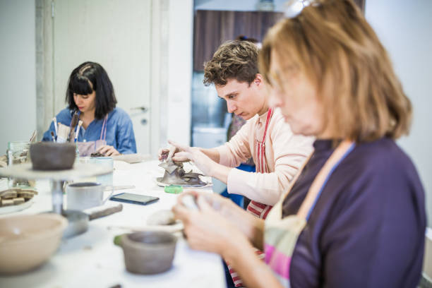 istock Group of people learning ceramic art. 1049288798