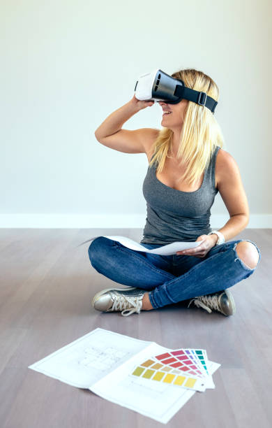 istock Woman watching with virtual reality glasses 1049292684
