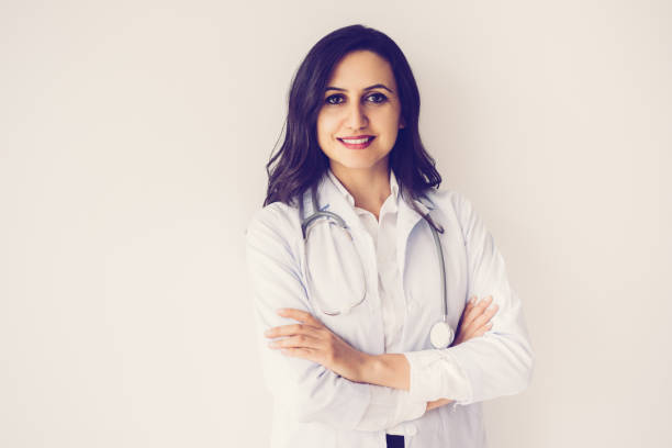 istock Confident Pretty Middle-aged Female Doctor 1049295580