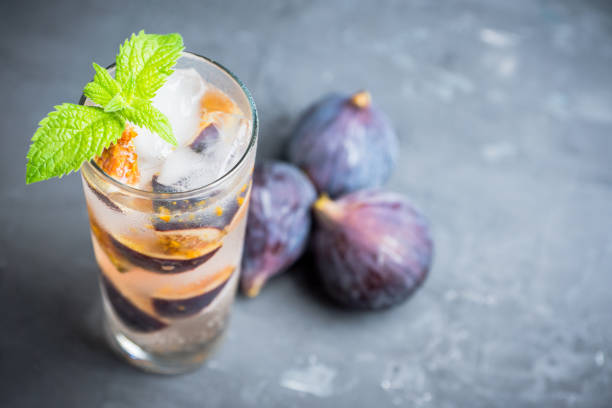 istock Figs mojito cocktail on the wooden background 1049295908