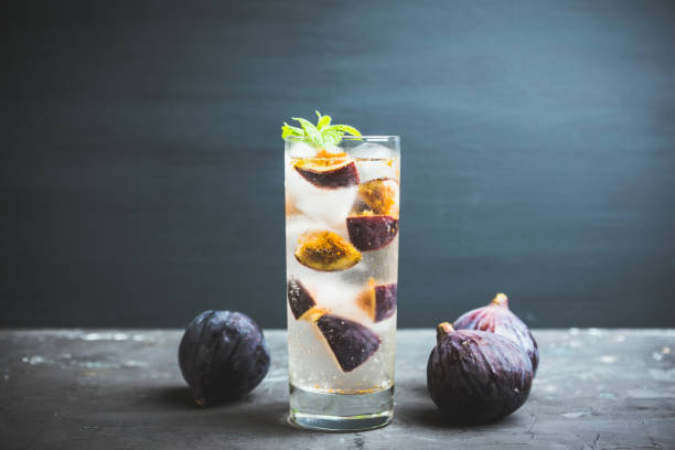 istock Figs mojito cocktail on the wooden background 1049295914