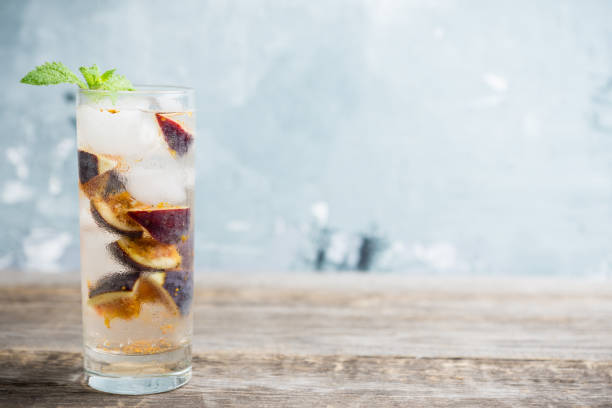 istock Figs mojito cocktail on the wooden background 1049295958