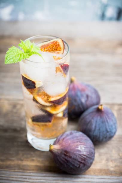 istock Figs mojito cocktail on the wooden background 1049295962