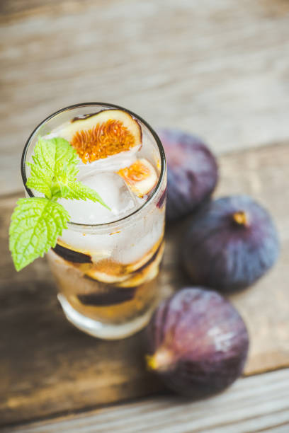 istock Figs mojito cocktail on the wooden background 1049295972