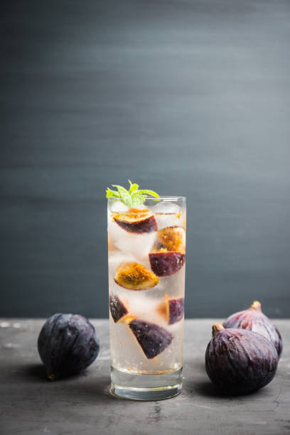 istock Figs mojito cocktail on the wooden background 1049295992