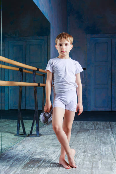 boy ballet dancer posing at  dance class stock photo