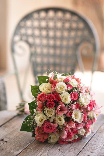 istock wedding bouquet from small roses on a table 1049299790