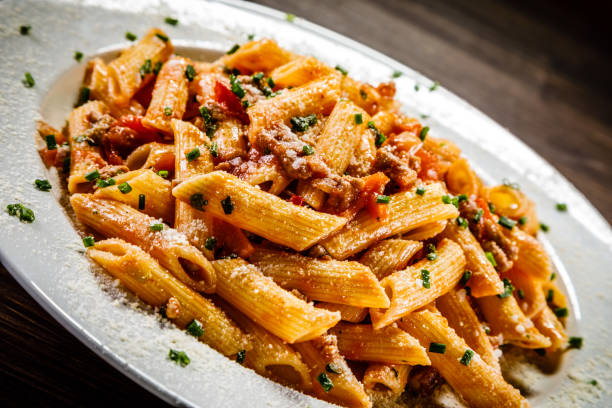 istock Penne with tomato sauce and pork 1049303108