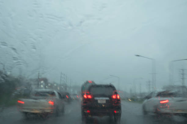 istock Driving on a rainy day and heavy rain viewed from the windshield 1049303548
