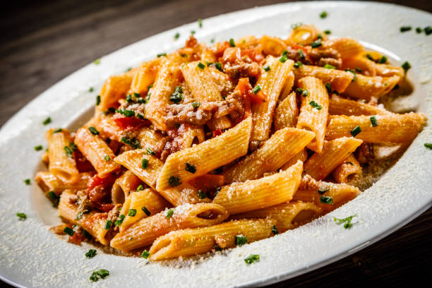 istock Penne with tomato sauce and pork 1049305542