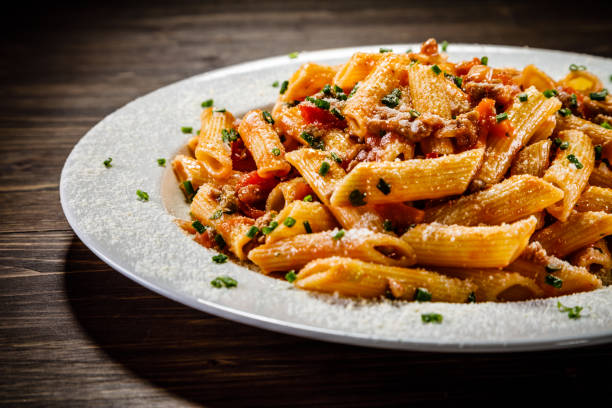 istock Penne with tomato sauce and pork 1049305816