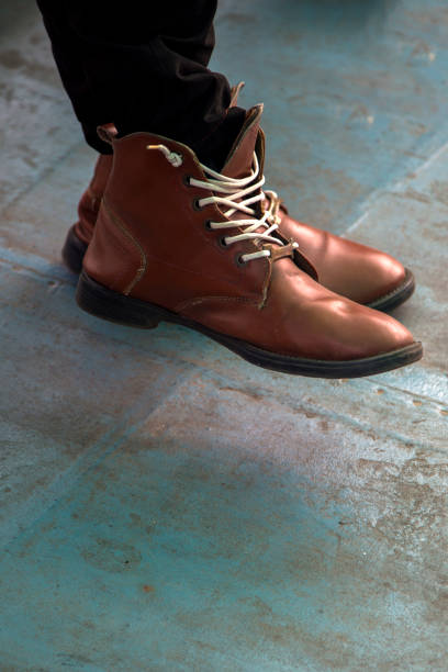 istock Lether shoes on the legs 1049317414