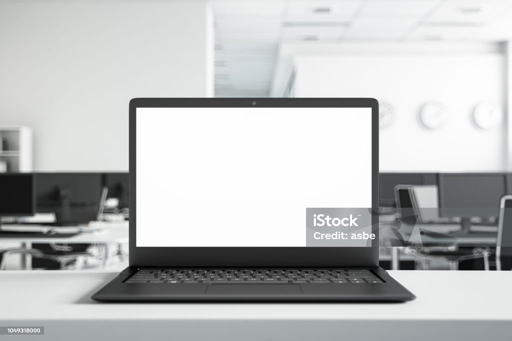 Mock Up Laptop Screen at the Office Blank laptop screen with office background Laptop Stock Photo