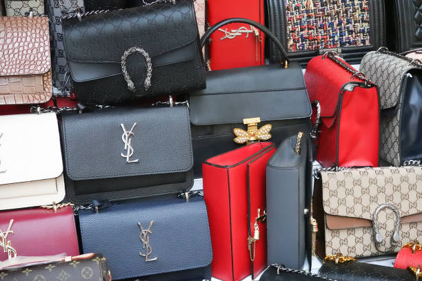 Bunch of fake brand bags at the bazaar. Istanbul, Turkey, September 22., 2018: Bunch of fake brand bags at the bazaar fashion bazaar stock pictures, royalty-free photos & images