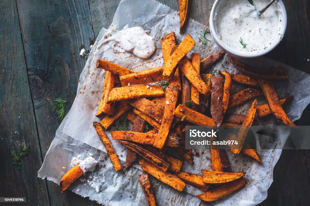 Sweet Potato Fries with Cajun Spices and Yogurt and Dill Sauce Sweet Potato Stock Photo