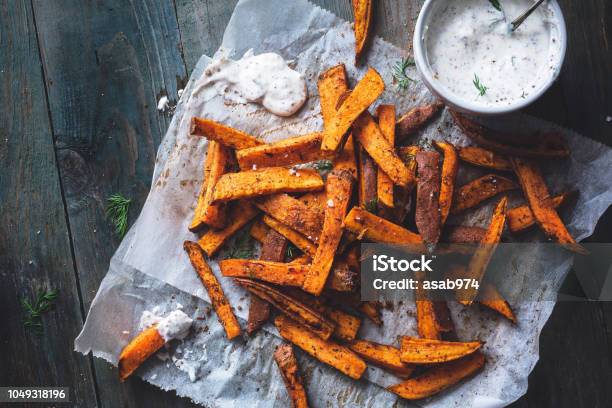 Sweet Potato Fries With Cajun Spices And Yogurt And Dill Sauce Stock Photo - Download Image Now
